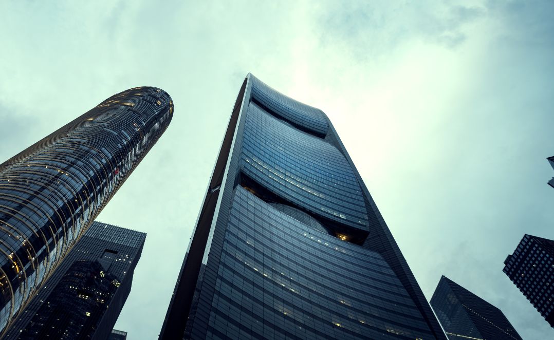 Looking up at skyscrapers from the ground outside