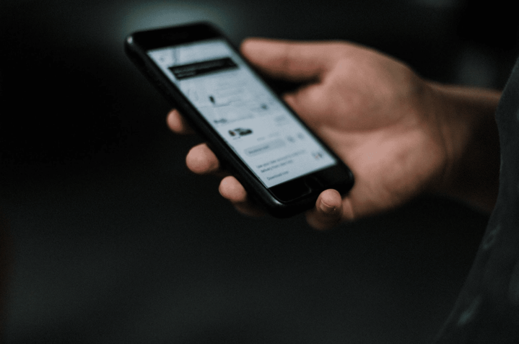 Man using Uber app before car accident.