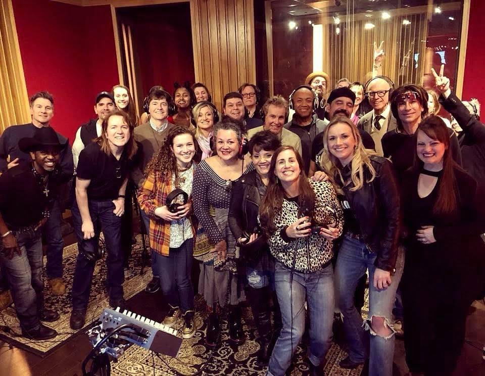 Music for the Mission, A group photo of musicians. Two dozen people stand smile and show their appreciation.