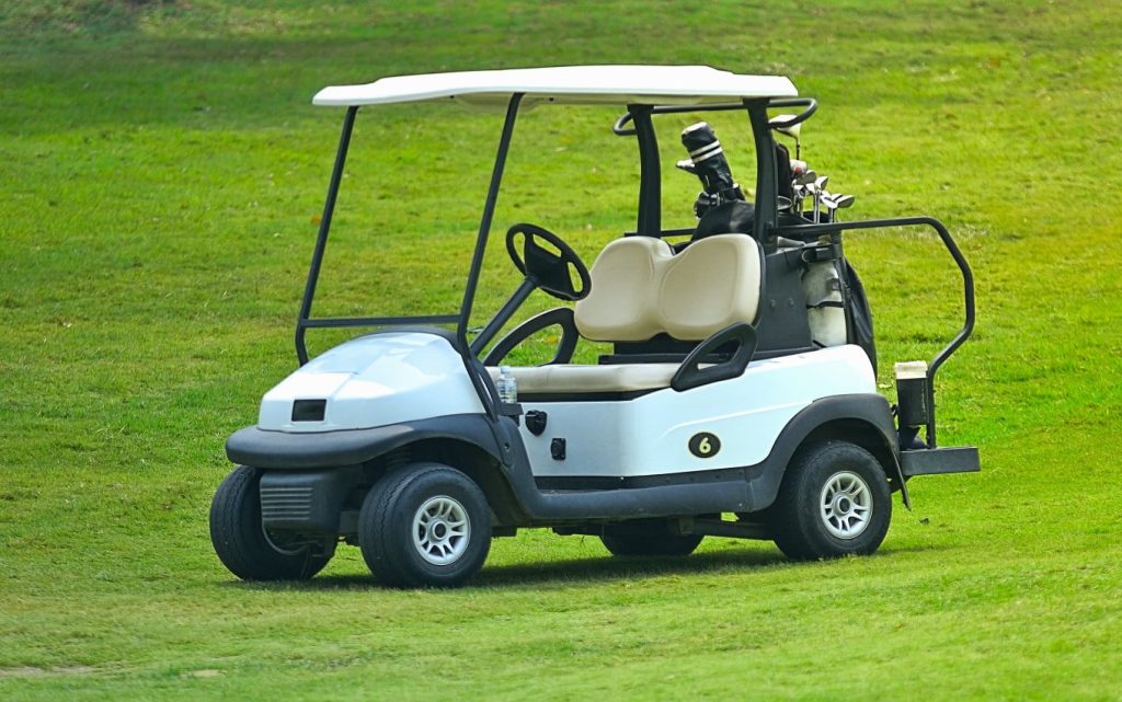 A golf cart On a fairway at the golf course