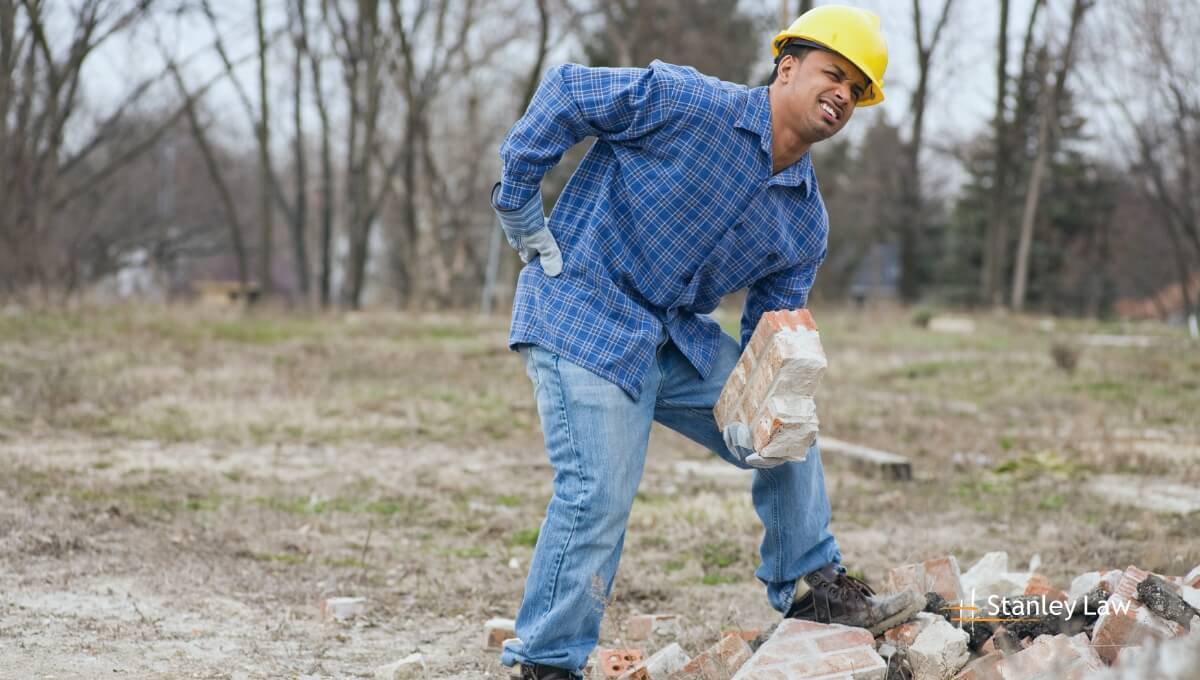 A worker having back pain - Stanley Law Office