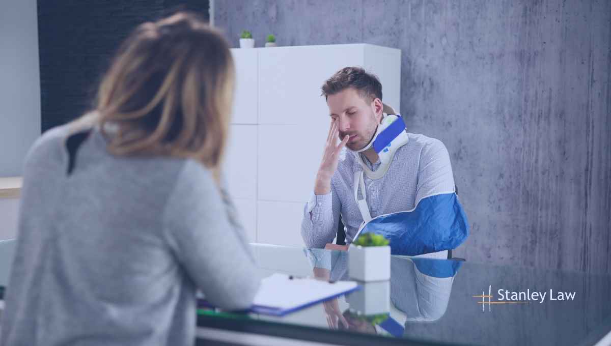 A worker talking with the employee after a workplace accident - Worker Comp Lawyer