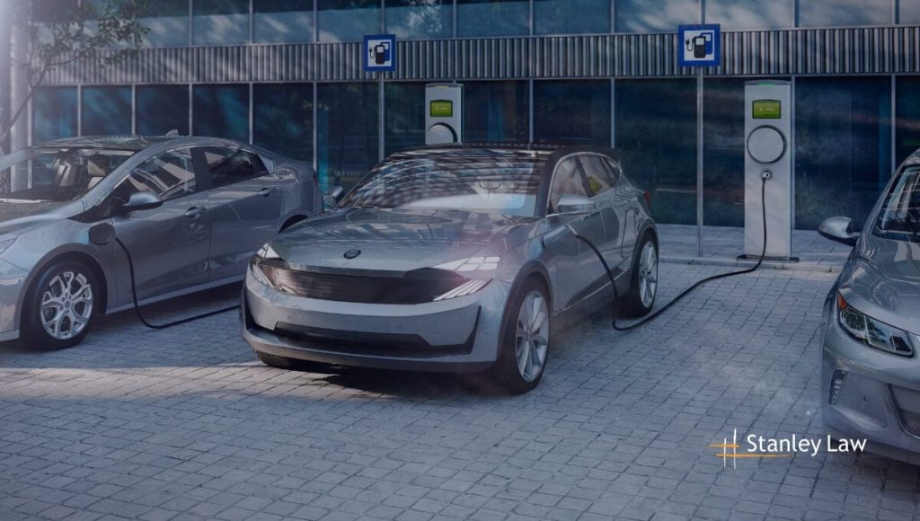 An electric car charging - Stanley Law Office