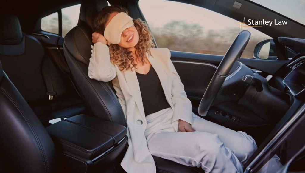A girl sleeping while leaving car on auto pilot - Stanley Law Office