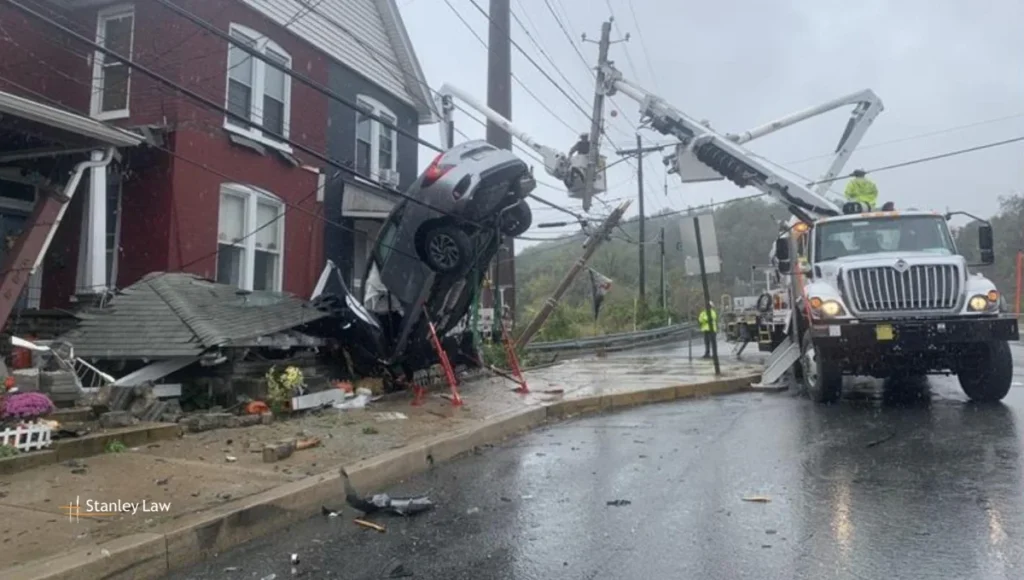 Woman Hospitalized After Car Crashes into Home