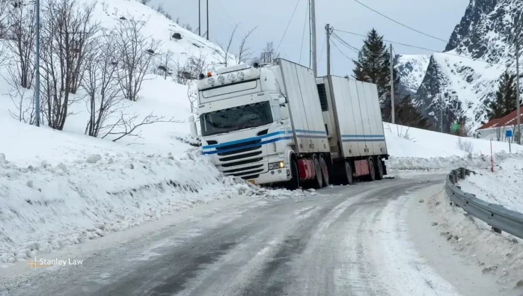 Driver Hospitalized After Dump Truck Flips Into Home