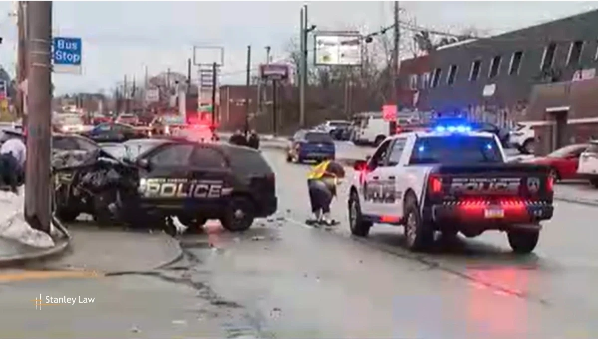 Officer and Two Others Injured in Collision