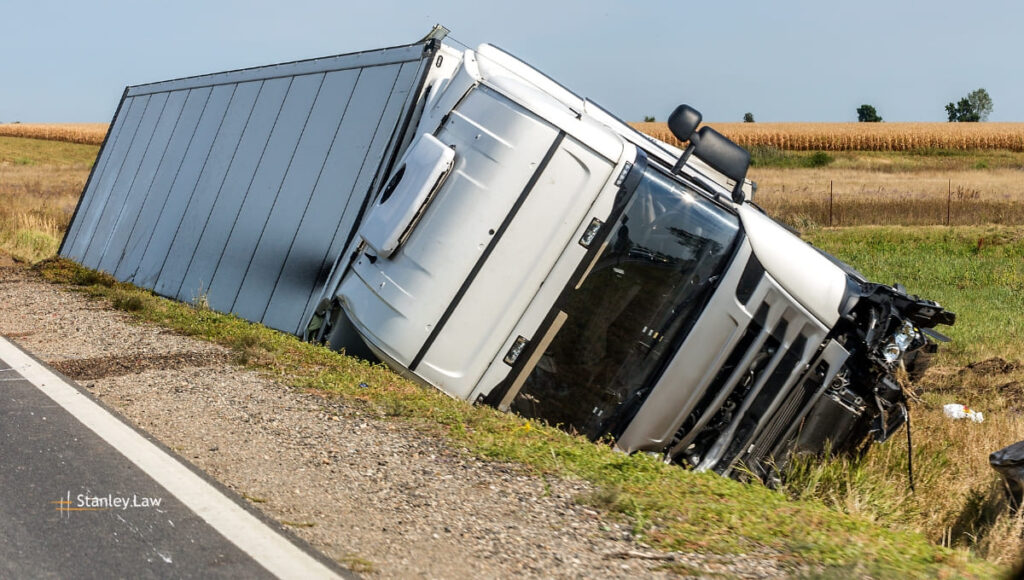 One Hospitalized After Two-Vehicle Truck Crash
