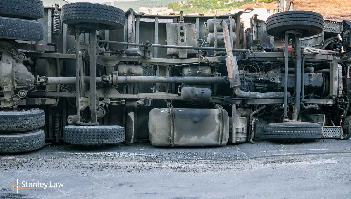 Two Drivers Hospitalized After Dump Truck Overturns
