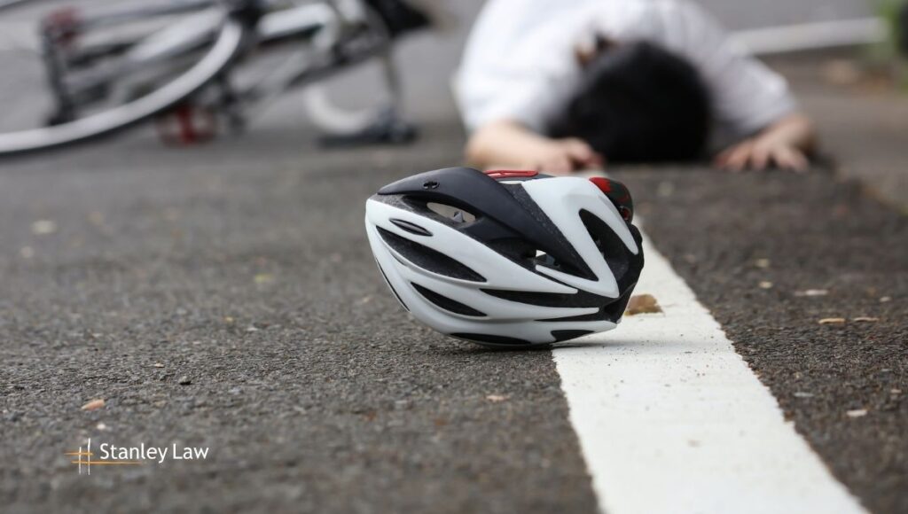 Two E-Bike Riders Injured in Collision with Vehicle